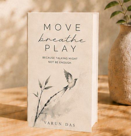 The Move Breathe Play book standing on a wooden table